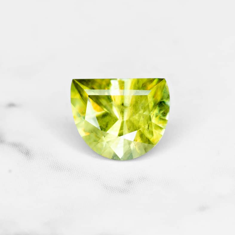 Sphene / Titanite, Madagascar 0.75 Ct half moon